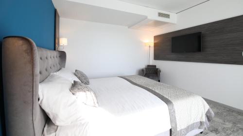 Postel nebo postele na pokoji v ubytování Boutique Hotel Portorose