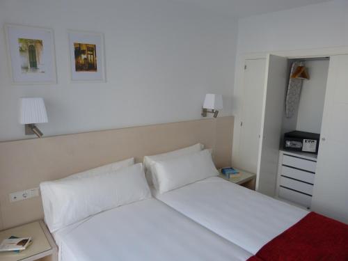 Posteľ alebo postele v izbe v ubytovaní Apartamentos Patagonia Sur