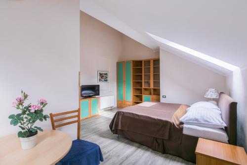 Postel nebo postele na pokoji v ubytování Duskova Apartments