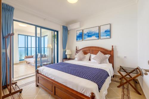Ένα ή περισσότερα κρεβάτια σε δωμάτιο στο Listen to the Sea Apartment