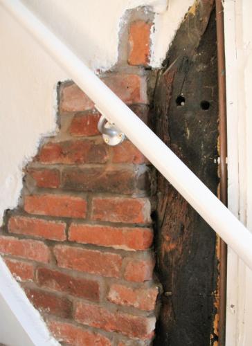 a brick stairway with a door in a brick wall at Forest Farm Papplewick Nottingham - Spacious Self-Contained Rural Retreat! in Papplewick