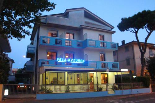 a building with a sign that reads villa gamma at Hotel Vela Azzurra in Rimini