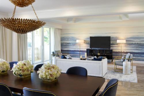 a living room filled with furniture and a table at Trump National Doral Golf Resort in Miami