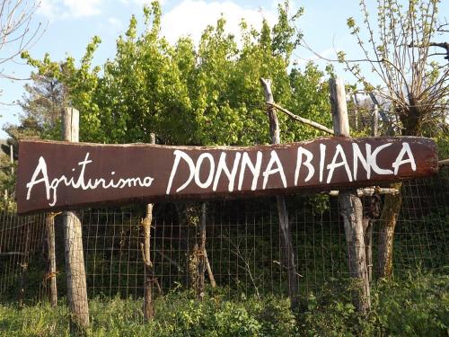 a sign that reads antiochina domina blanca on a fence at Agriturismo Donna Bianca in Mormanno
