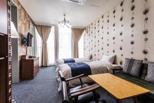 Tempat tidur dalam kamar di Incheon Aiport Airrelax hotel