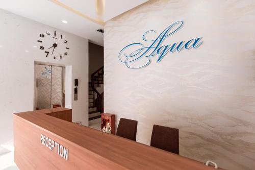 a lobby of a salon with a sign on the wall at AQUA Seaview Hotel in Nha Trang