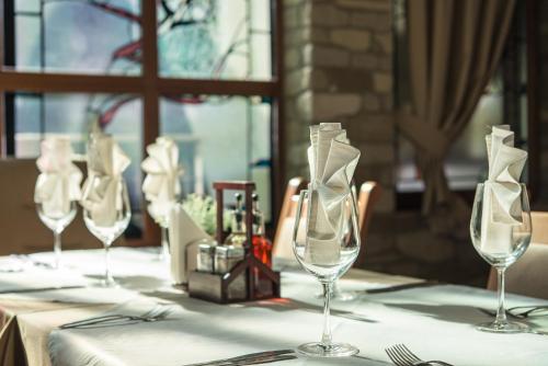 a table with four wine glasses on top of it at SPA complex Elena in Elena