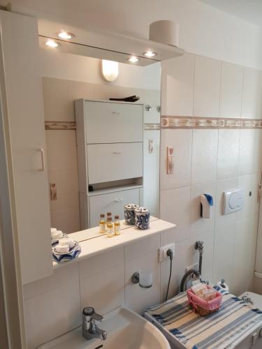 a bathroom with a sink and a mirror at House Camogli in Camogli