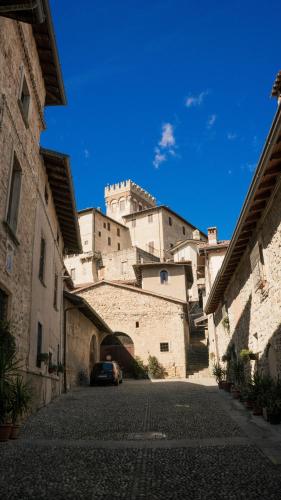 a view of a building with a car parked on a street at Casa Mysa - Apartment in Costa di Mezzate