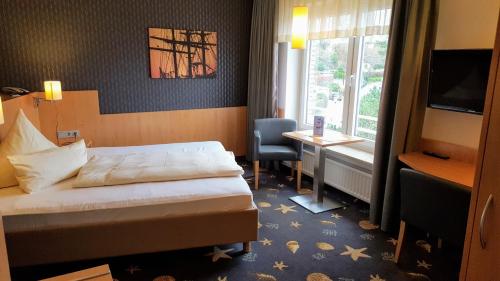 Ein Bett oder Betten in einem Zimmer der Unterkunft Hotel Seeterrassen
