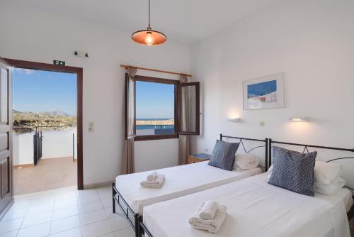 Ένα ή περισσότερα κρεβάτια σε δωμάτιο στο Aphrodite White Studios Lindos