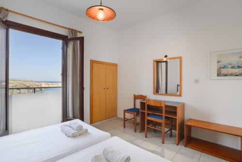Ένα ή περισσότερα κρεβάτια σε δωμάτιο στο Aphrodite White Studios Lindos