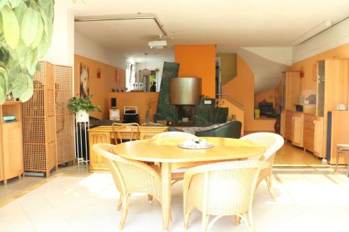 a dining room with a table and chairs at Dimai House No 31 Dornbirn Messe in Dornbirn