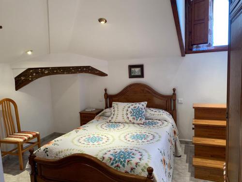 Postel nebo postele na pokoji v ubytování Pensión Gijonés