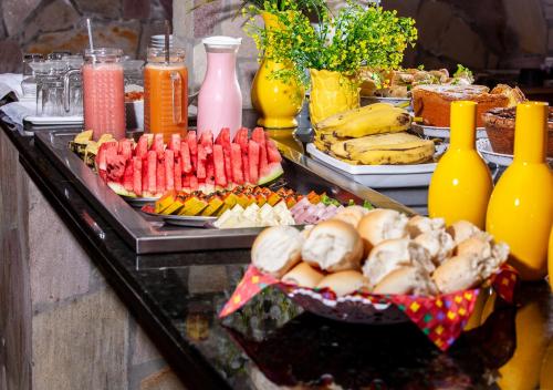 a buffet with many different types of food on a table at Castelo Beach Hotel in Natal