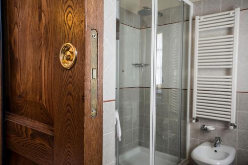 a bathroom with a shower and a toilet and a sink at Antica Pieve B&B in Tavarnelle in Val di Pesa