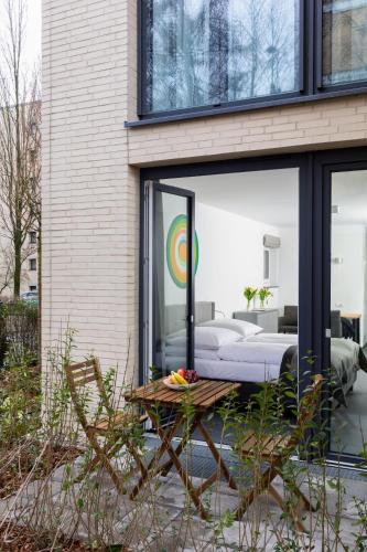 a bedroom in a house with a bed and a table at Boardinghouse St.Pauli in Hamburg