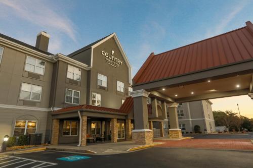 a rendering of a hotel with a building at Country Inn & Suites by Radisson, Myrtle Beach, SC in Myrtle Beach