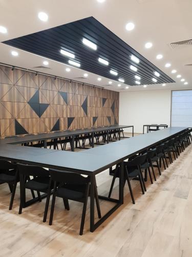 a large conference room with tables and chairs at Babaneuris Marani in Babaneuri