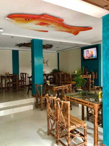 TV a/nebo společenská místnost v ubytování Hostal Puyo