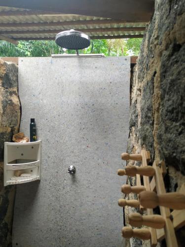 a view from the inside of a wall with a table and chairs at Sitio Simple Life in Ubatuba