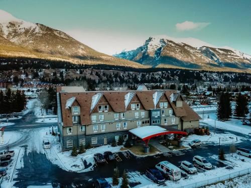 an aerial view of a resort with snow covered mountains at Super 8 by Wyndham Canmore in Canmore