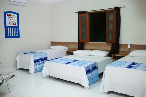 Katil atau katil-katil dalam bilik di Pousada Portugal
