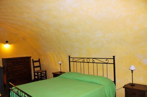 Letto o letti in una camera di Castello di Populonia VILLA A MARE