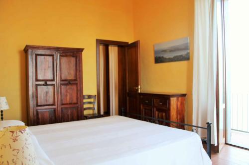 Letto o letti in una camera di Castello di Populonia VILLA A MARE
