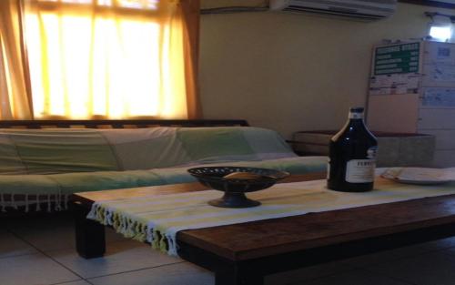 a bottle of wine on a table in a room at San Juan Hostel in San Juan
