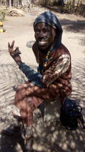 a statue of a man sitting on a bench at Chez Bethy Jungle et Océan in Abene