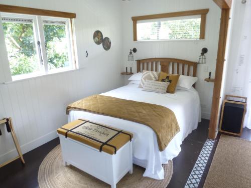 Ένα ή περισσότερα κρεβάτια σε δωμάτιο στο Paradise Grove