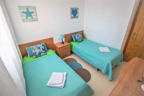 En eller flere senge i et værelse på Residence Vacanza Torre Monaco
