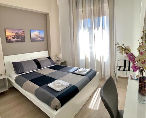 Letto o letti in una camera di Ambasciatori B&B