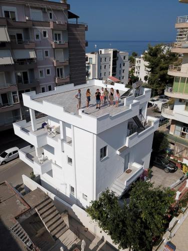 a group of people standing on the roof of a building at Villa Orkidea in Sarandë