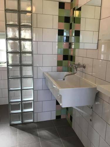 Ein Badezimmer in der Unterkunft Het Bijhuisje