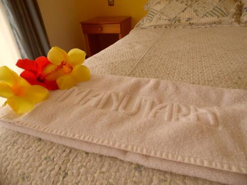 Cama o camas de una habitación en Hotel Manutara