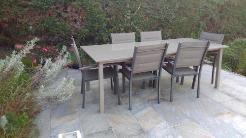 a table and chairs sitting on a patio at Hillside View in Plentzia