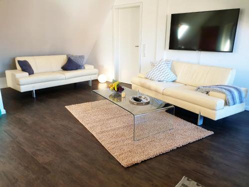 a living room with two couches and a coffee table at Seeperle 4 in Meersburg