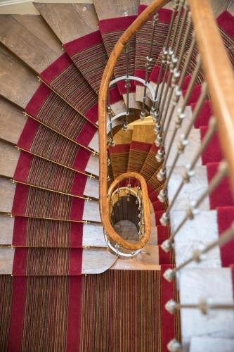 an overhead view of a wooden spiral staircase at Hotel Clos Castel Villas Spa in Casteljaloux