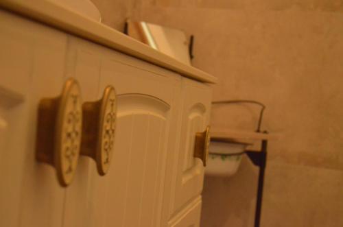 a bathroom cabinet with two mirrors on top of it at B&B Casa Santa Lucia in Manerba del Garda