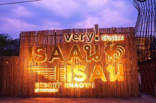 a sign for aasyasyasyasyasy sign on a fence at Recall Isaan Isan Concept at Khaoyai SHA Extra Plus in Mu Si