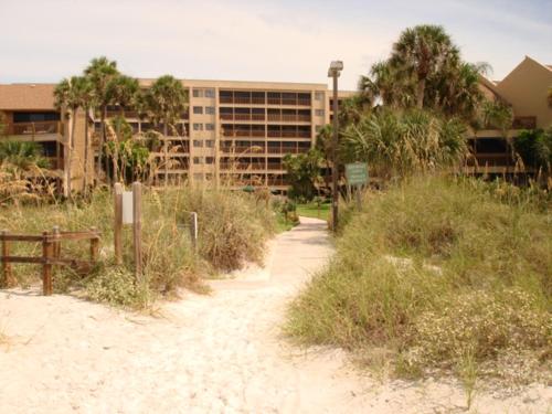 a dirt path in front of a building at Midnight Cove #532, Bayside in Siesta Key, FL in Siesta Key