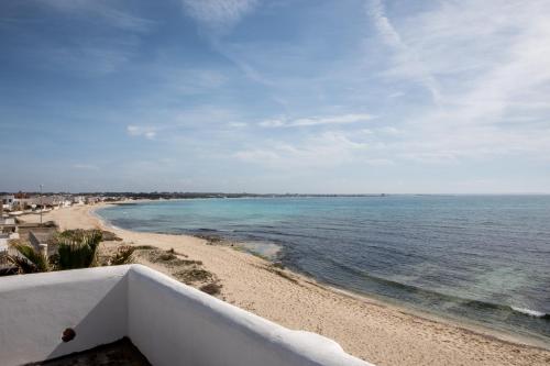 a view of a beach with the ocean at Villa Layla on the beach in Torre Lapillo
