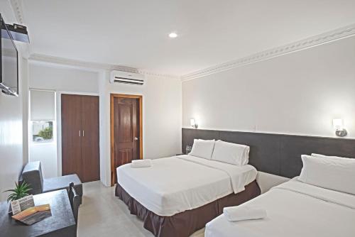 Postel nebo postele na pokoji v ubytování Hotel La Ría Playas