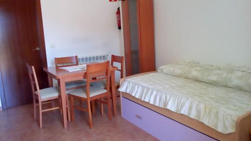En eller flere senge i et værelse på turismo rural del somontano (Alquiler de apartamentos)
