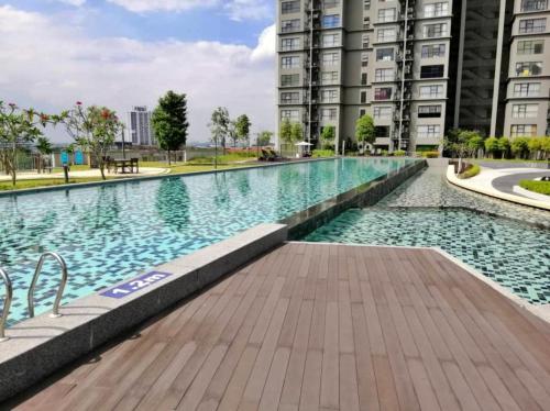 a swimming pool in the middle of a building at The ComfyHauz # Cyberjaya in Cyberjaya