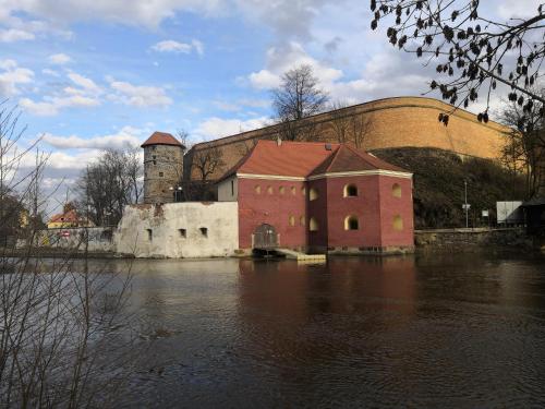 a building in the middle of a body of water at Penzion Na Svahu in Cheb