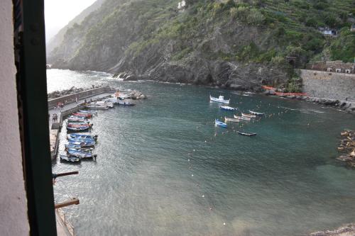 a group of boats in the water next to a mountain at Silver Flat in Vernazza