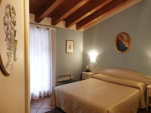 Postelja oz. postelje v sobi nastanitve Villa Serena Agriturismo